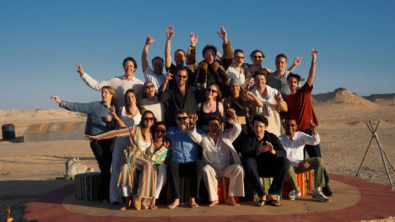 A group celebrating together in the desert near Dakhla