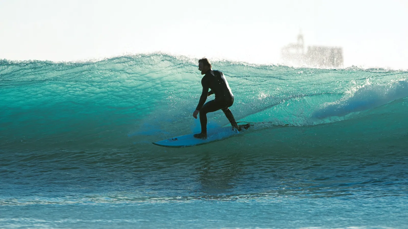 Surfer riding a wave on the Atlantic coast near Dakhla