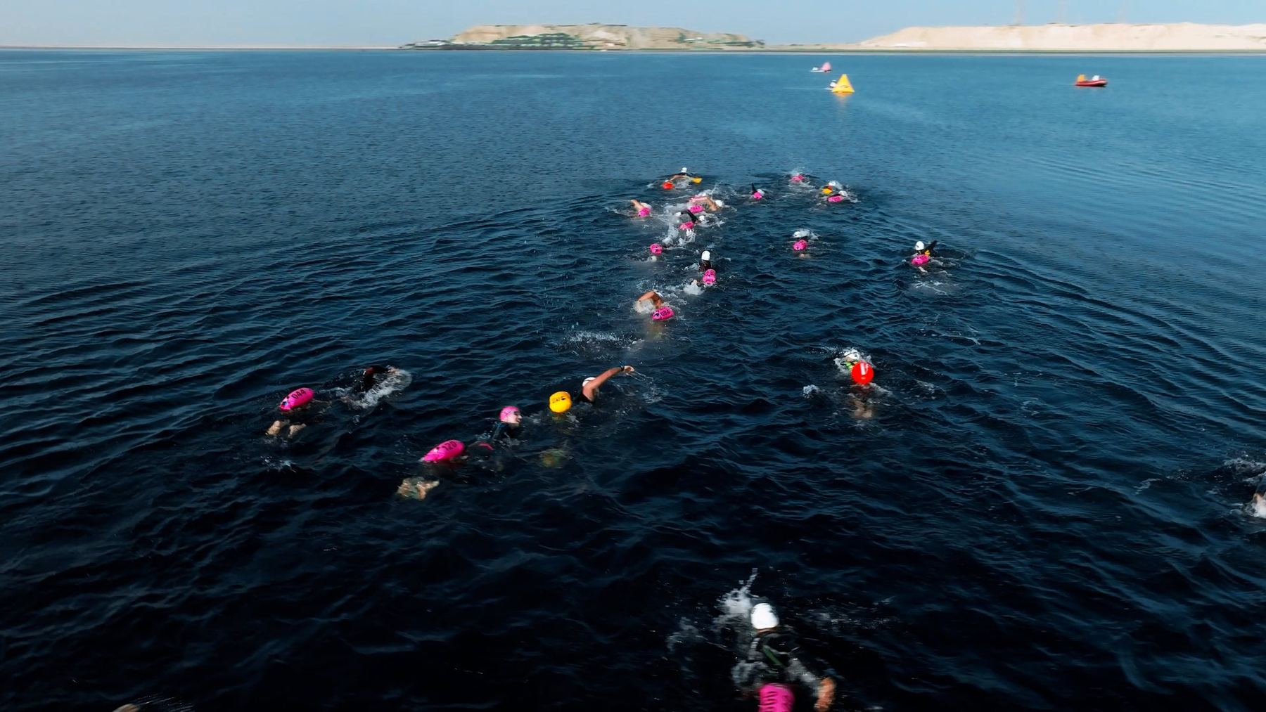 Swimmers crossing the lagoon